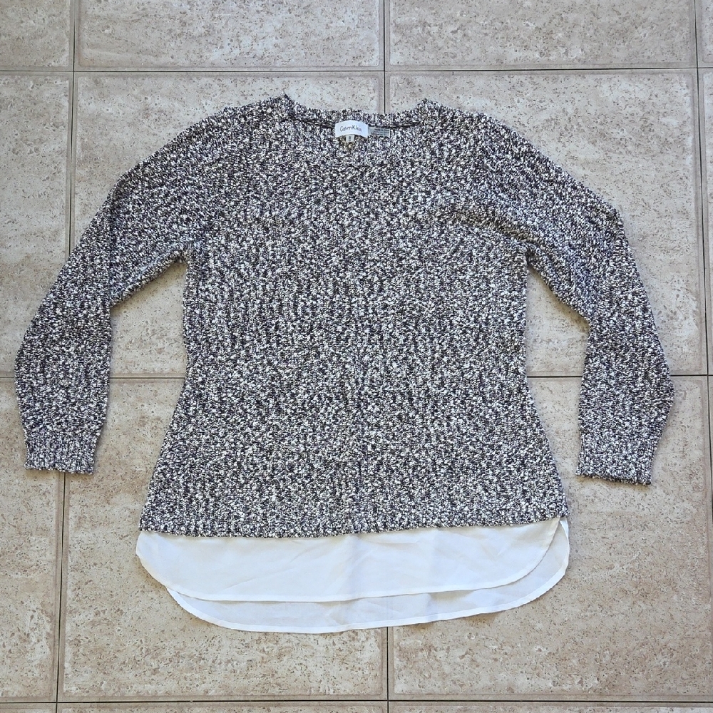 Black and White Knit Sweater with Layered Hem